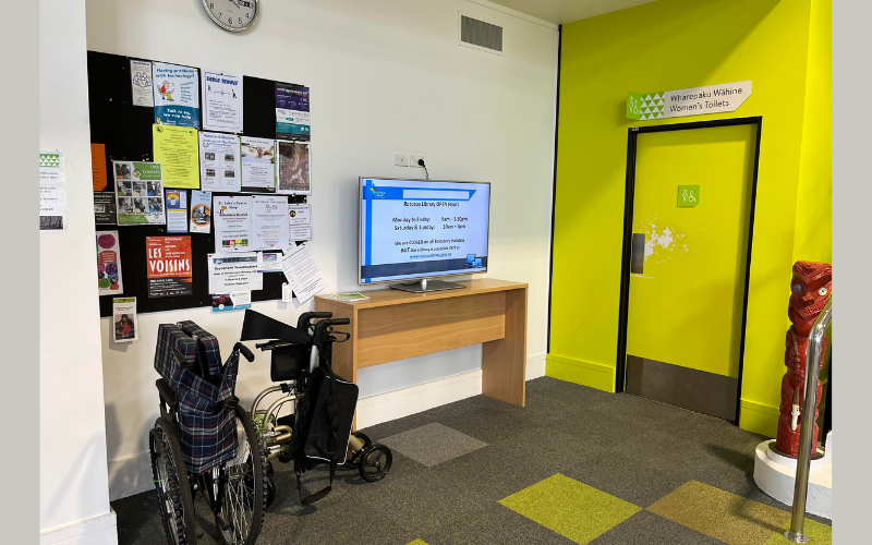 A walker and wheelchair are stored near the women's toilets on the ground floor.